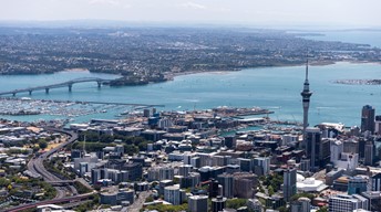Auckland City Centre on sunny day with Skytower and Harbour Bridge